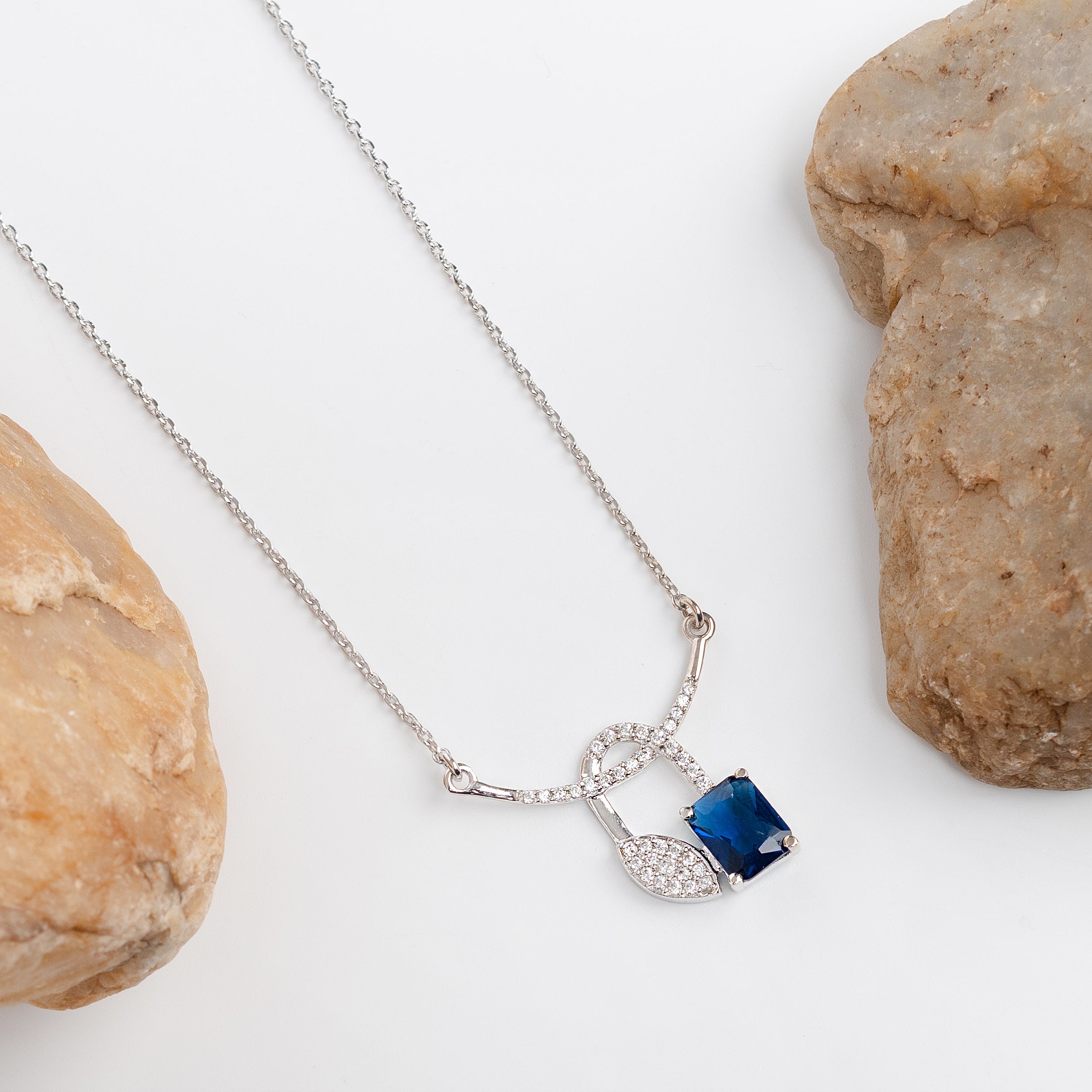Azure Knot Drop – Premium Pendant Necklace in Silver with Blue Stone