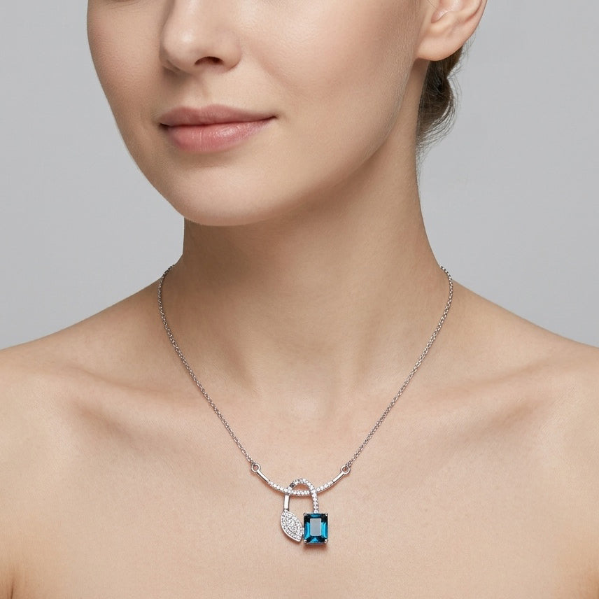Azure Knot Drop – Premium Pendant Necklace in Silver with Blue Stone
